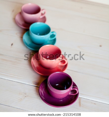 Bright dishes on table on a wooden background