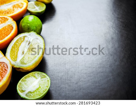 sliced citrus fruit on a black background. food