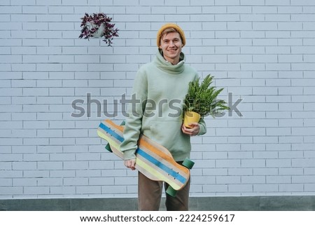 Similar – Image, Stock Photo Smiling man with longboard on street