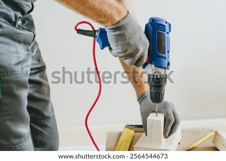 Image, Stock Photo Unrecognizable handyman using machine on factory