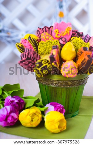 Variety of fruits (strawberry, banana, pineapple) covered with a color chocolate, decoration of Mother Day party table