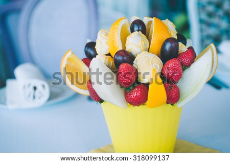 Fruit bouquet decoration on the dining table, fruit bouquet in focus