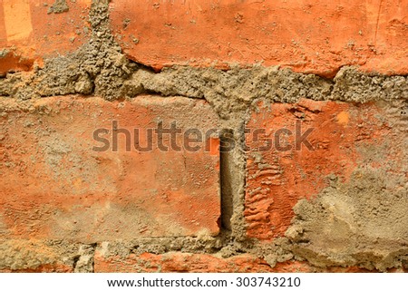 a wall of red brick close-up