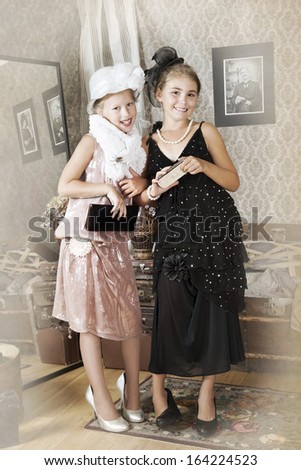 Vintage style portrait of little girls. Intentional 1900's style post processing emulation.