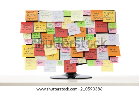 Computer monitor with post-it notes on it
