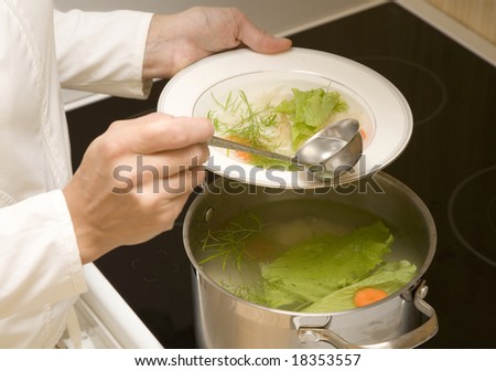 Woman is making vegetable soup
