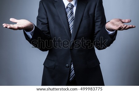 Businessman wearing a suit, Helpless, hand, give up, shrug, shoulders, do not know Foto stock © 
