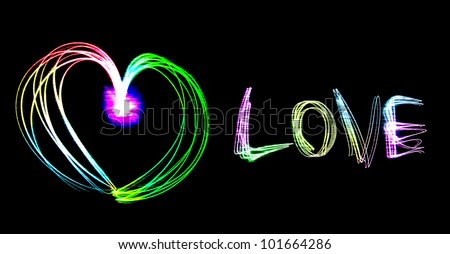 Heart shape and love letter sparkle drawing by flashlight multiple color in the night