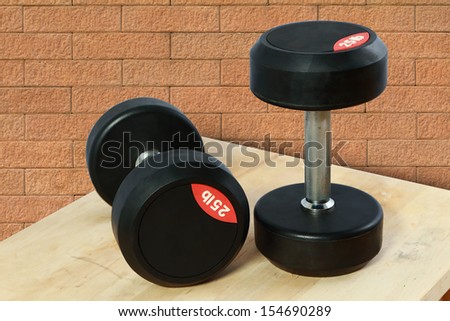 The dumbbell, a type of free weight, is a piece of equipment used in weight training. It can be used individually or in pairs, with one in each hand