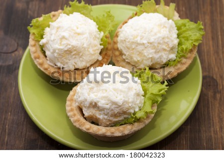 Tartlets with cheese and egg balls. Boiled egg yolk with grated cheese in egg protein.