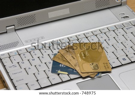 Several credit cards on laptop