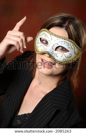 Brunette model with a masquerade mask on her face