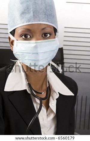 Young attractive african doctor with face mask and stethoscope