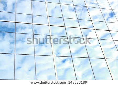 background of blue sky reflect on glasses from modern business building