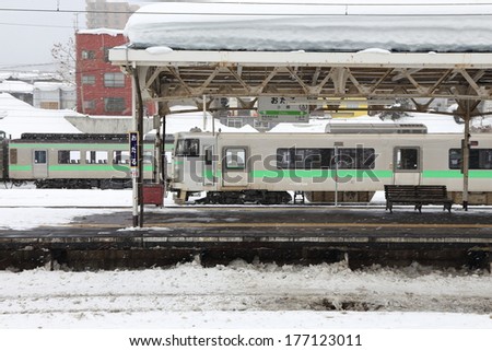 OTARU JAPAN - FEBRUARY 13 :   heavy snow  in Otaru train station in Sapporo , Japan  on February 13, 2014. This  snow storm has killed 19 people and caused more than 1,600 injured around the country