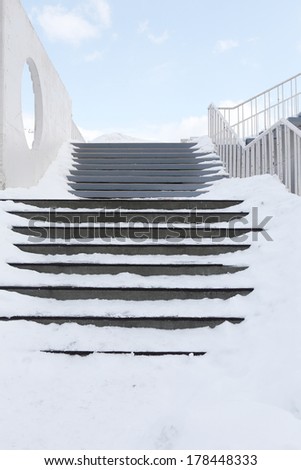 frozen stair steps cover with snow in winter