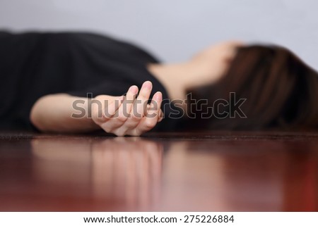 dead woman\'s body focus on hand