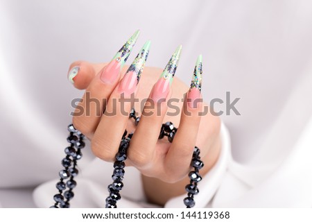 Female hands displaying beautiful polished nails