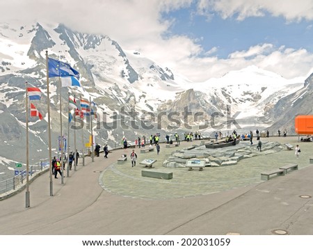 HEILIGENBLUT, AUSTRIA - 27 June 2014: Tourists at the visitor center at Kaiser-Franz-Josefs-Hoehe. The Pasterze glacier is in the background.