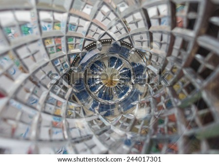 An abstract macro shot looking down into a cut glass vase.