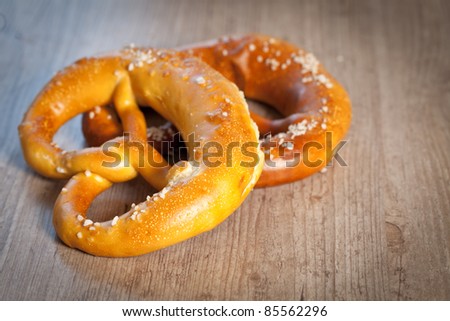Typical crusty german pretzel bread with beer
