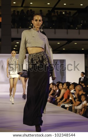 BANGKOK - MAY 2 : A model wears clothes by Thai fashion students at the fashion design contest on May 2, 2012 at CTW Bangkok, Thailand. Accademia Italiana teams up with f.fashion to organize this event.
