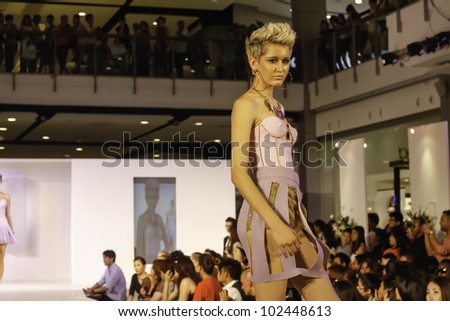 BANGKOK - MAY 2 : A model wears clothes by Thai fashion students at the fashion design contest on May 2 2012 at CTW Bangkok Thailand. Accademia Italiana teams up with f.fashion to organize this event.