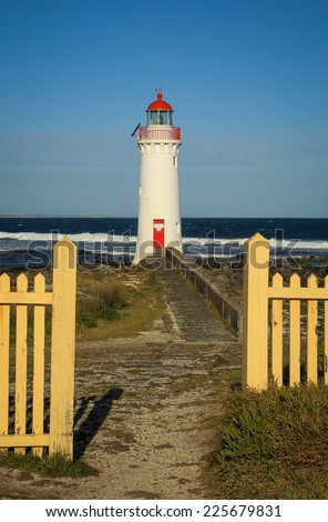 Port Fairy lighthouse (c1859) on Griffiths Island in Victoria, Australia in late afternoon light.