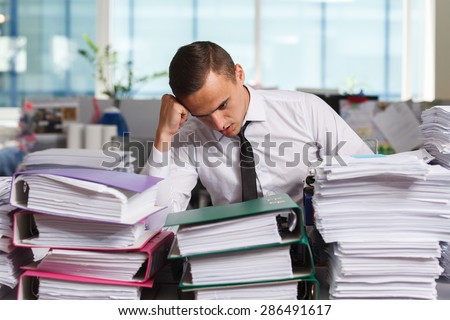 Stressful manager have so many paperwork in the office