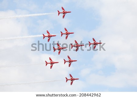 CLEETHORPES, ENGLAND JULY 27TH: Royal Air Force Red arrows perform an aerobatic display at Cleethropes airshow on 27th July 2014 in Cleethorpes England.
