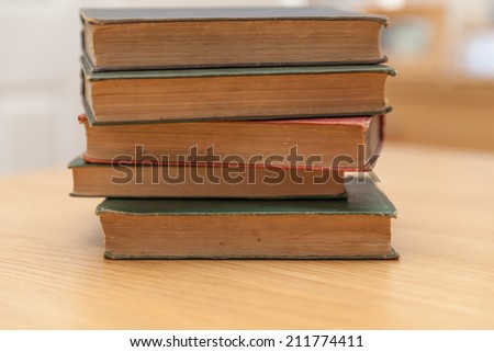 Very old books on desk, books are around 100 years old
