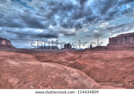 Monument valley HDR in Utah USA with first thunder clouds.