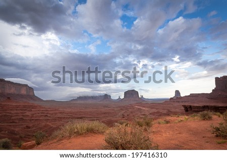 scenic view big cloud on mesa in Monument Valley. Sandstone formation in Monument Valley before thunder.