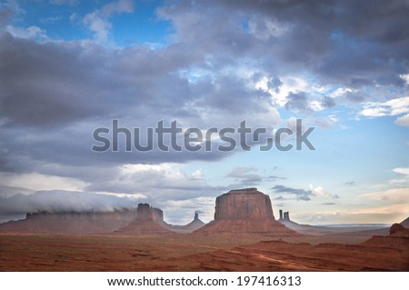big cloud on mesa in Monument Valley. Sandstone formation in Monument Valley before thunder.