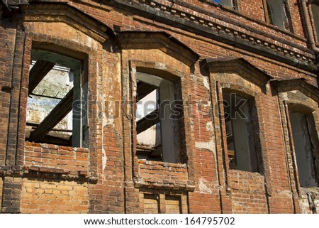 The old abandoned brick building on the bank of the Oka River