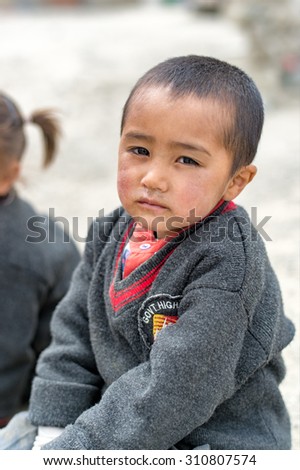 LEH LADAKH,INDIA-20 MAY 2014:  Boy  preparing to school in the morning is looking camera in Ladakh, India.