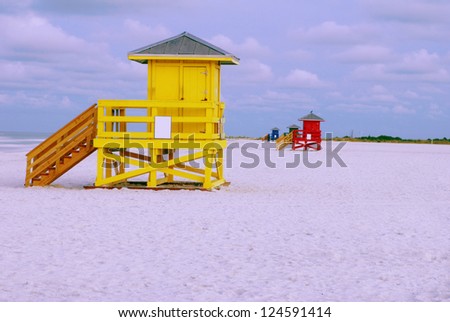 Similar – Image, Stock Photo four lifeguards in yellow hoodies and red pants on the beach