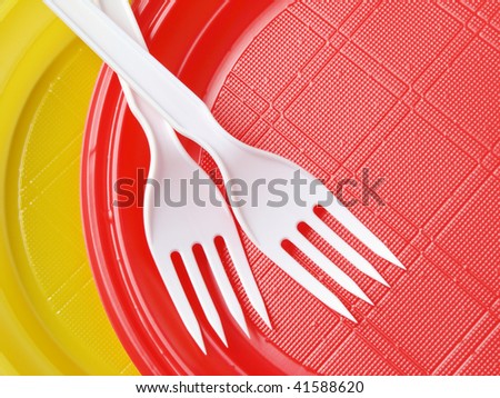red and yellow disposable plates with forks