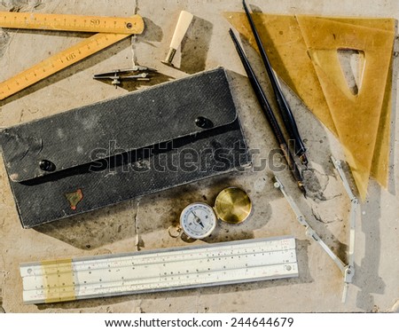 A collection of vintage drafting tools