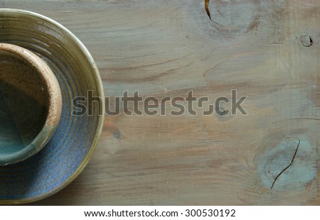 Pottery on a matching wooden background suitable for business ca