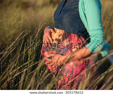 Portrait of pregnant woman having outdoor walk
