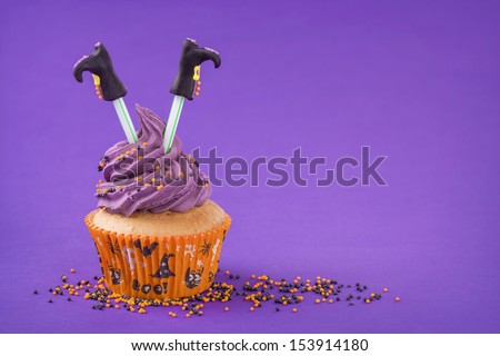 Halloween cupcake with witch legs