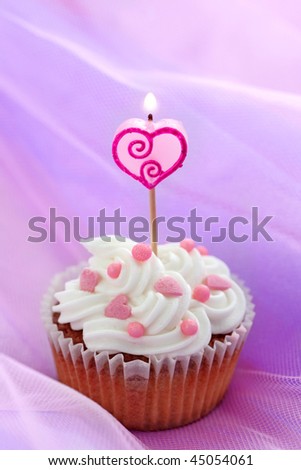 Birthday cake on lilac background