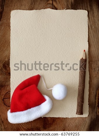Letter for santa with old parchment and santa hat