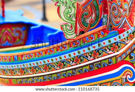 Colorful pattern of traditional fisherman boats These wooden boats were made and painted by boat makers in south of Thailand.