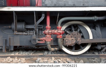 Detail of one wheel of a vintage steam train locomotive