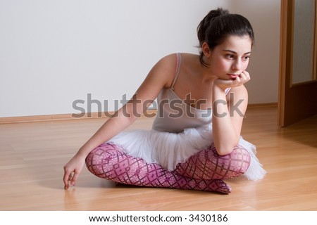 Sad girl in the ballet dress