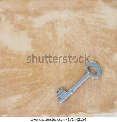 vintage key on old paper, background