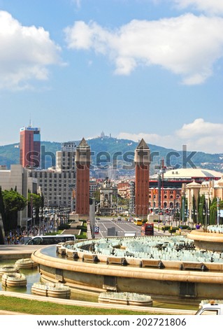 BARCELONA, SPAIN - AUGUST 11: Fountains and historic columns and the mountain of Tibidabo on August 11, 2011 in Barcelona, Spain. This place is a tourist attraction in the sity.