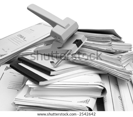 these are a stack of book-keeping documents and a big puncher